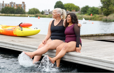 (L-R) Rowan wears Essential Tankini Top size 16 Hendricks, High Waist Bikini Bottoms size 18; Adya wears Long Sleeve Swimsuit size 12 Monroe